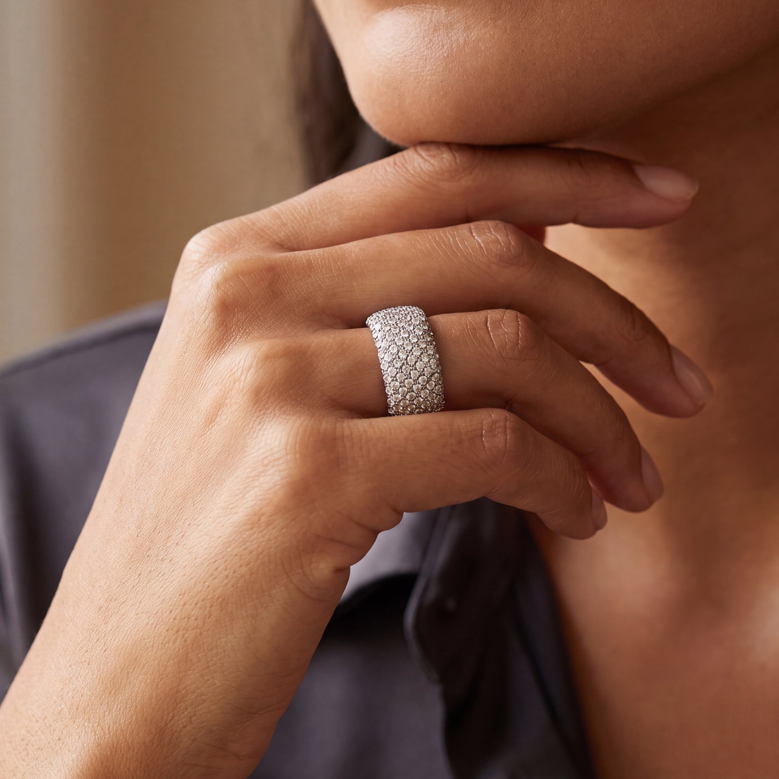 white gold pavé diamond ring on finger