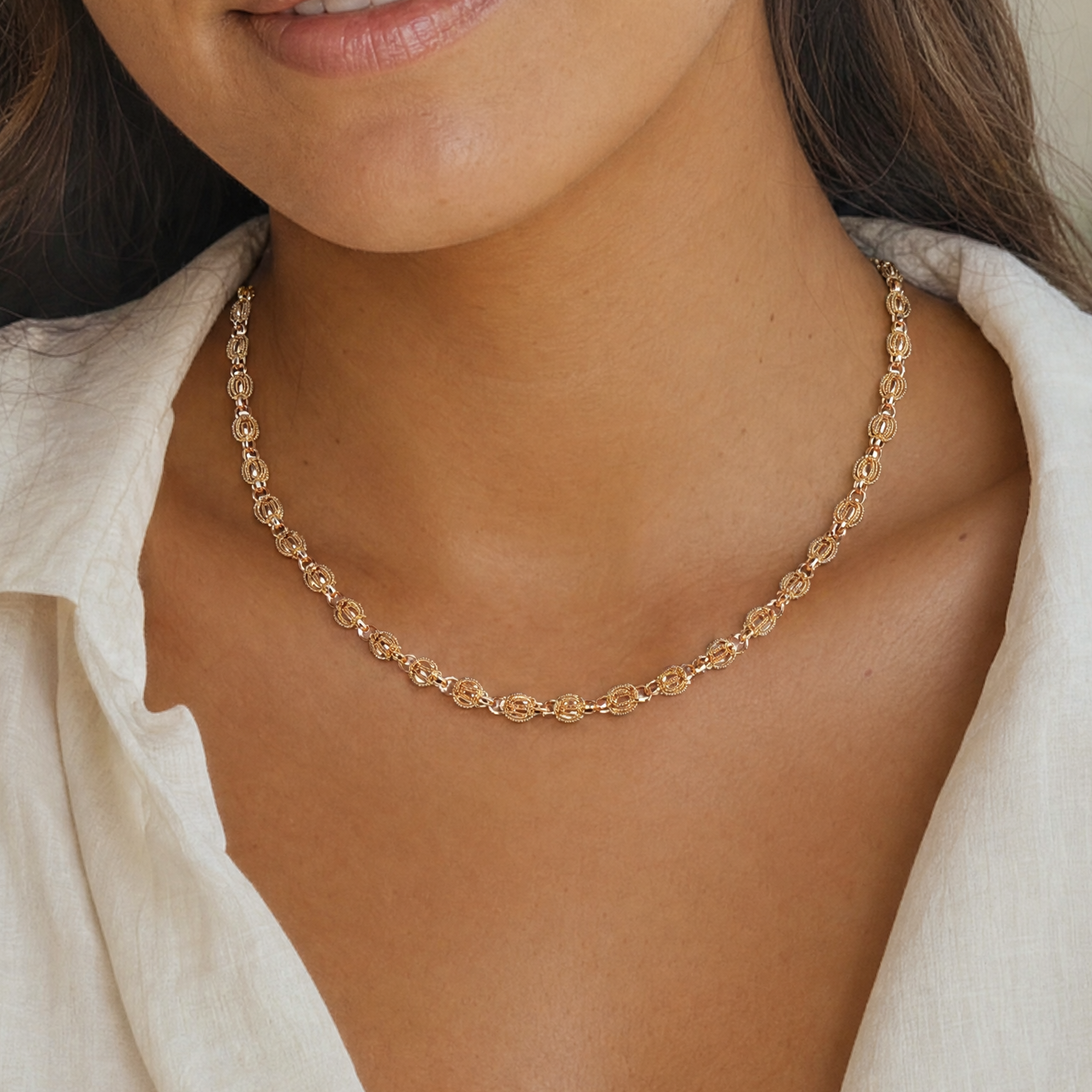 yellow gold knot chain necklace on woman