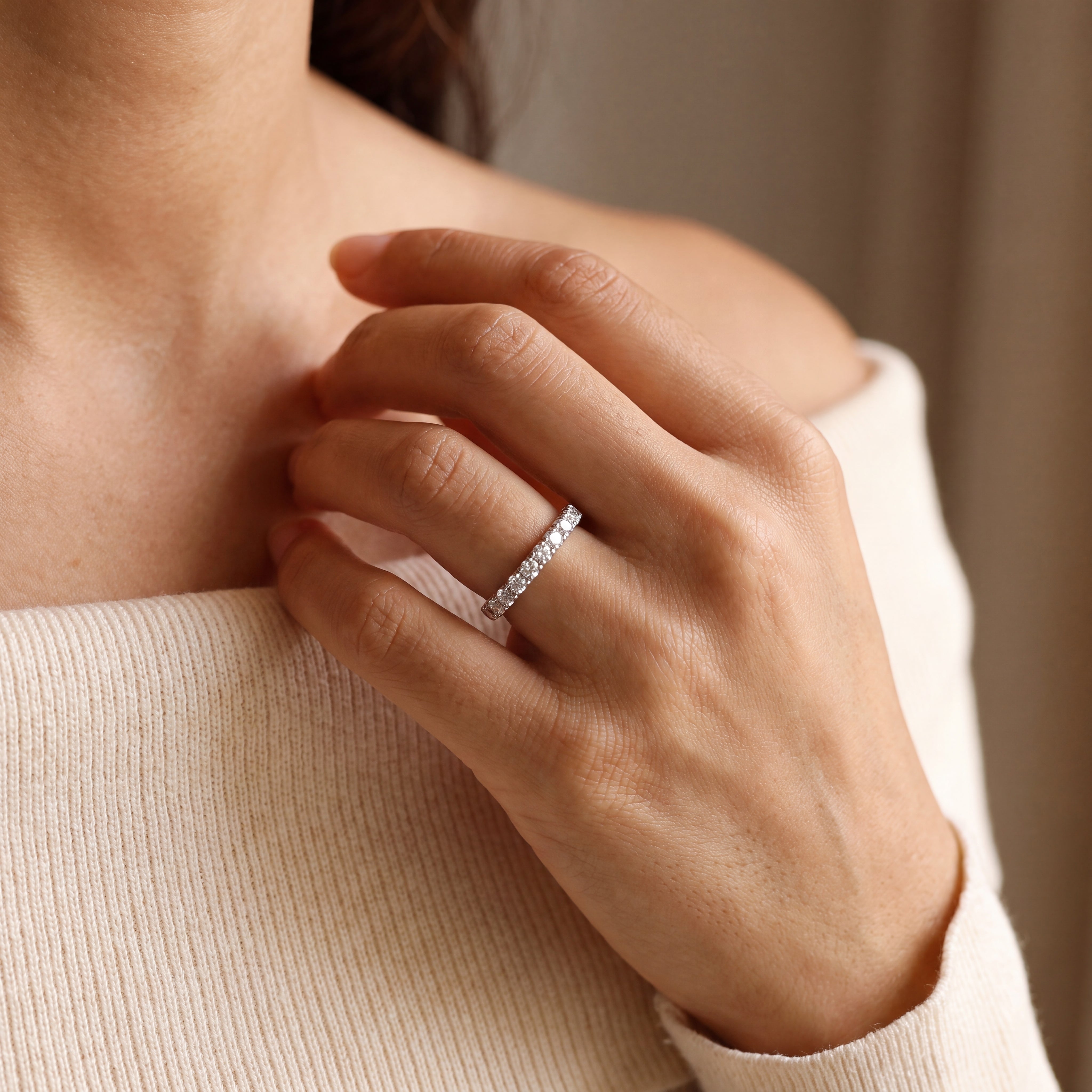 white gold diamond half eternity ring on finger 