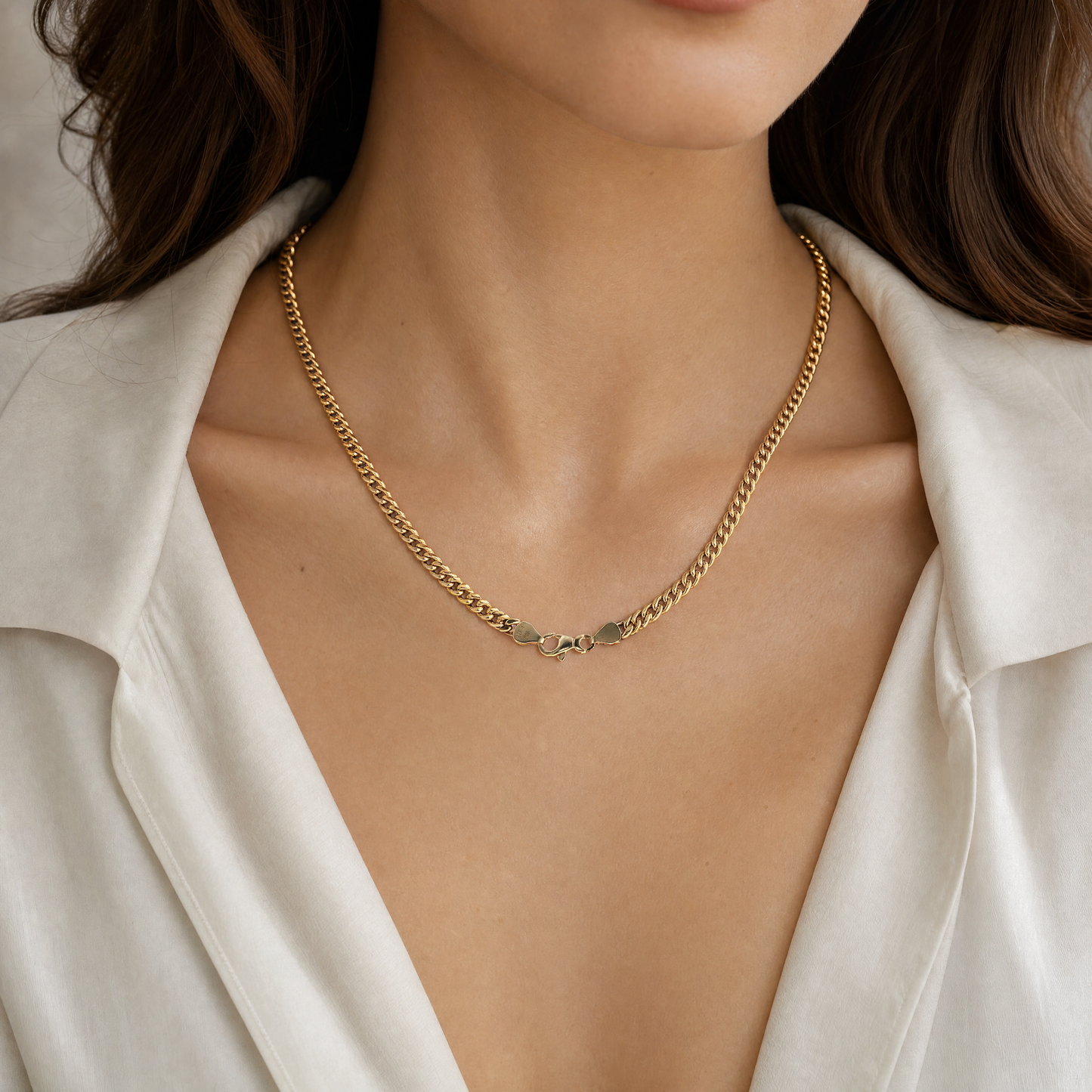 yellow gold curb chain necklace on woman 