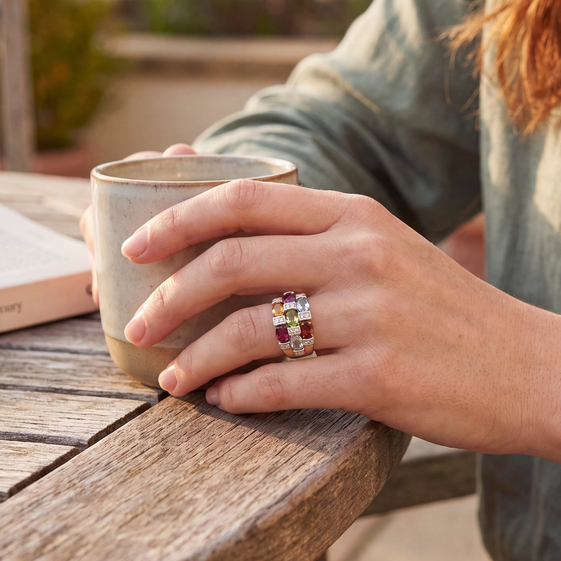 yellow gold multigem ring on hand