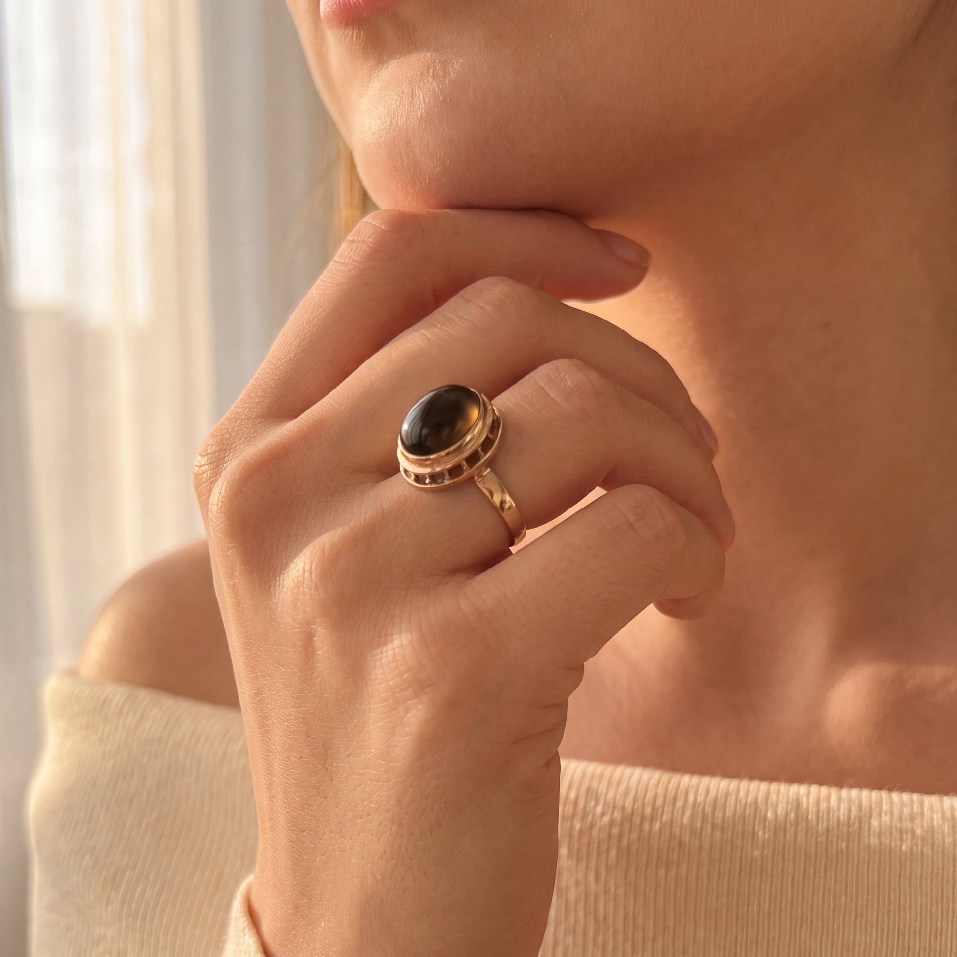 yellow gold ring with tiger eye center 

